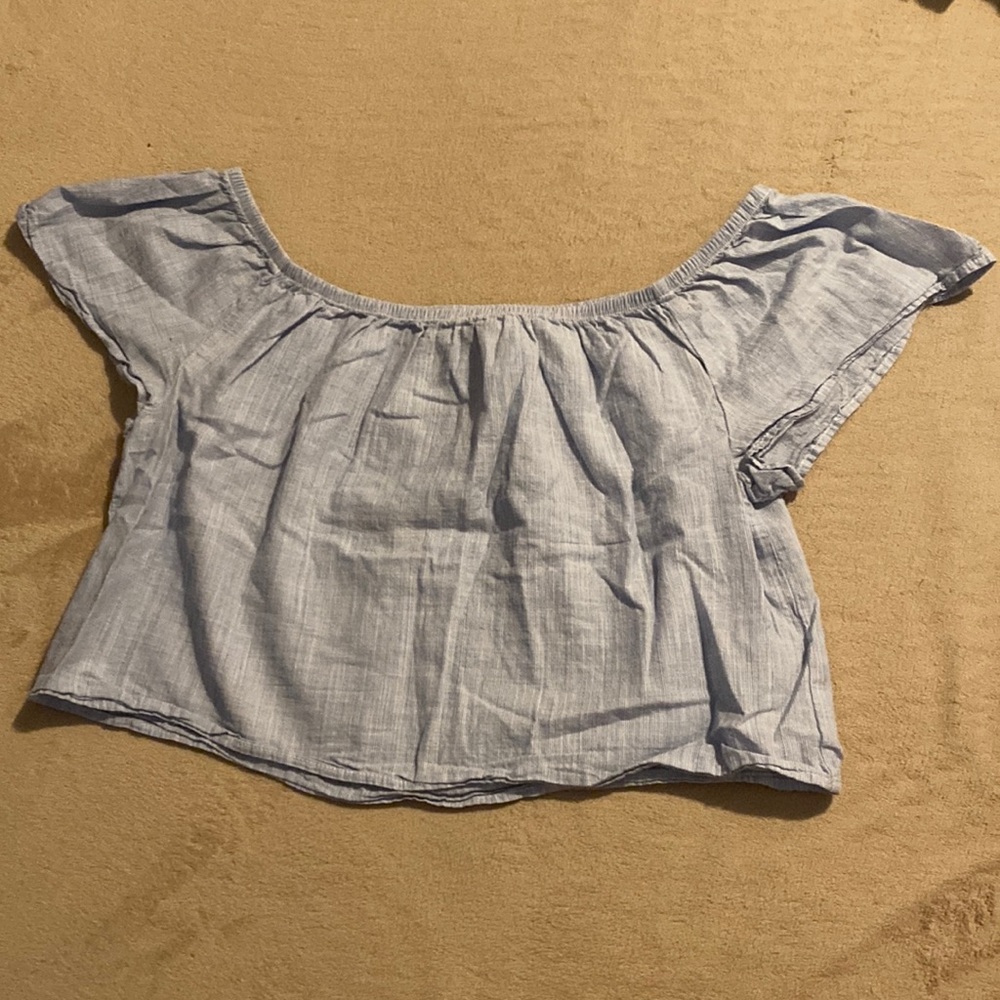 Blue off the shoulder cropped top. Brand is Black Swan and it’s a size small.